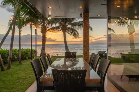 a view of a chair and table in the balcony