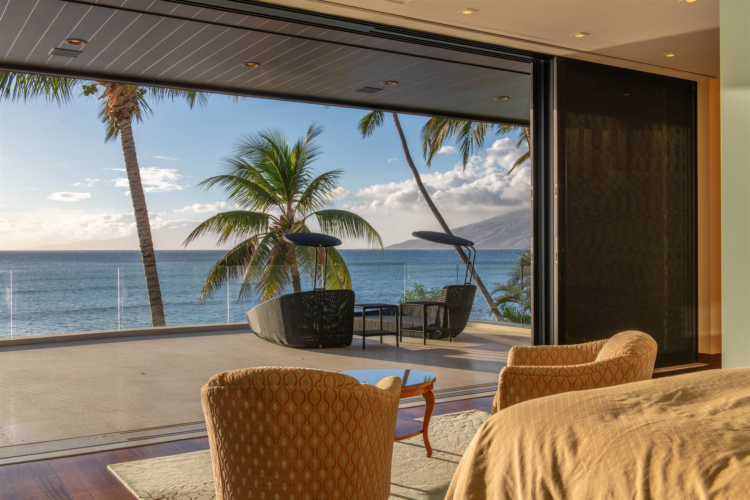 1750 Halama Street Kihei, HI 96753 - Photo 16 of 50 a bedroom with a bed a couch and large window