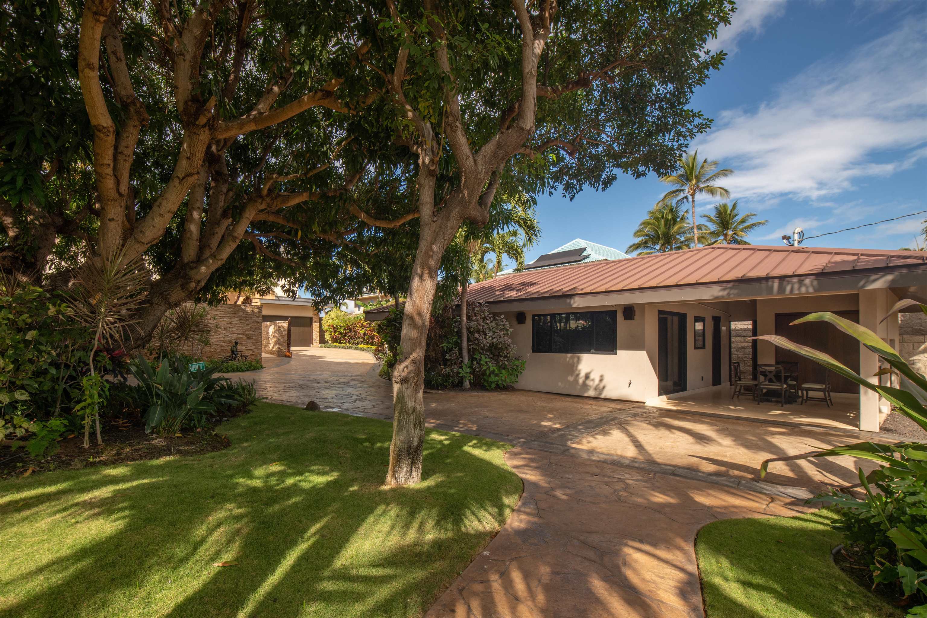 1750 Halama Street Kihei, HI 96753 - Photo 35 of 50 a backyard of a house with yard table and chairs