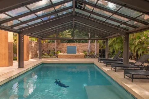 a view of an entryway with wooden floor and door