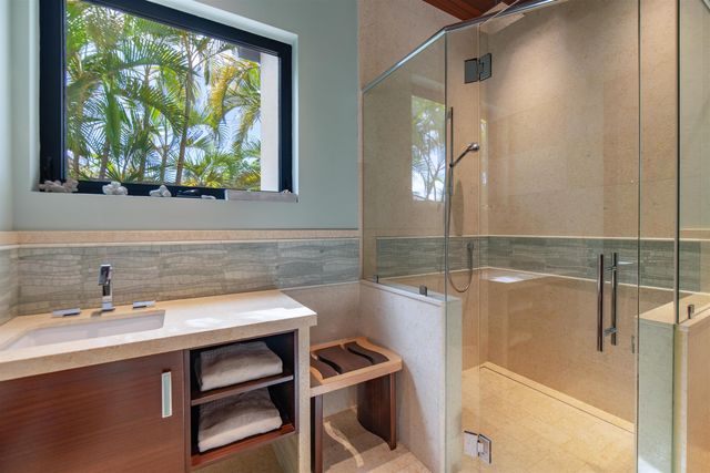 a kitchen with a table chairs refrigerator and stove