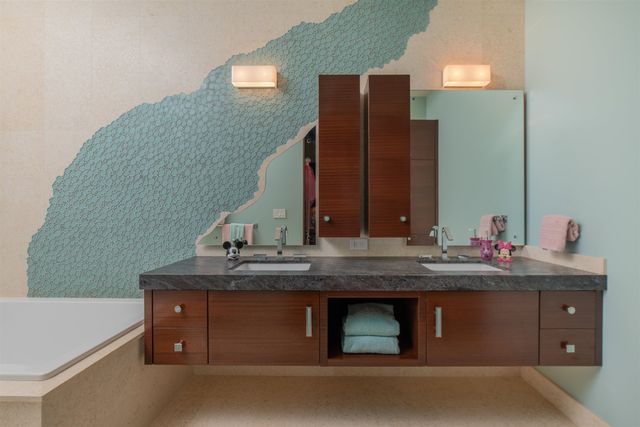 an aerial view of a house with garden space and plants