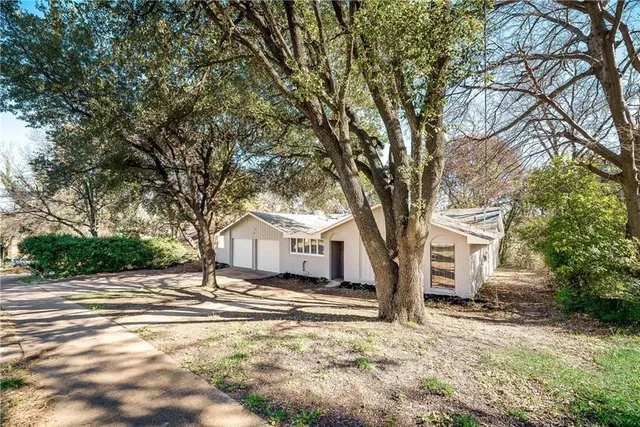 a house with trees in front of it
