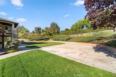 a view of a porch with furniture and garden