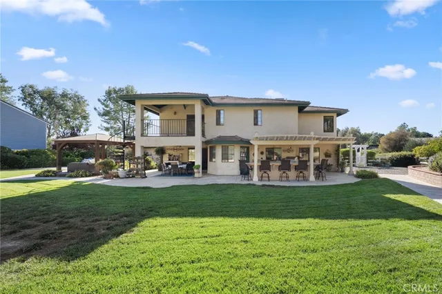 a spacious bathroom with a granite countertop tub and a sink