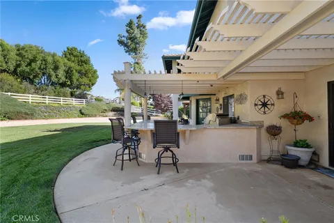 a bedroom with furniture and a fireplace
