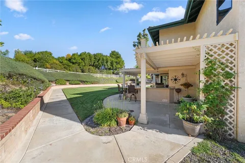 a bedroom with a bed window and a flat screen tv