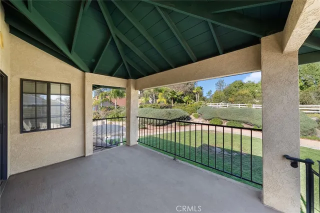 a bedroom with a bed dresser and a flat screen tv