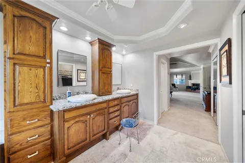 a bedroom with a bed dresser and a flat screen tv