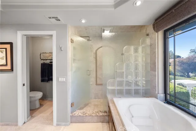 a bathroom with a granite countertop sink toilet and a mirror