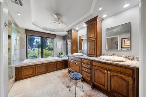 a bedroom with a bed dresser and a window