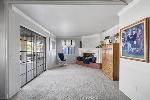 a living room with furniture a rug and a chandelier