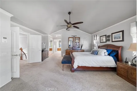 a view of a livingroom with furniture fire place wooden floor and fireplace