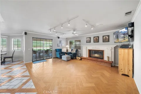 a front view of a house with a garden and plants