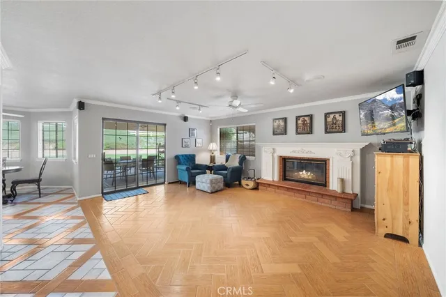 a front view of a house with a garden and plants