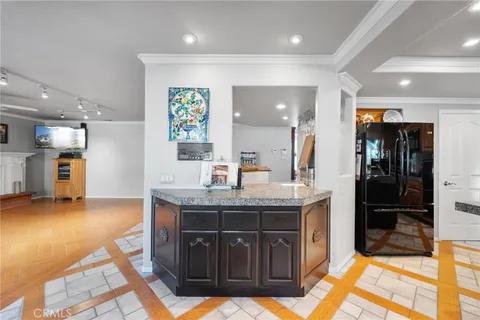 an aerial view of residential house with outdoor space and swimming pool