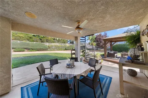 a kitchen with stainless steel appliances granite countertop a sink and wooden cabinets