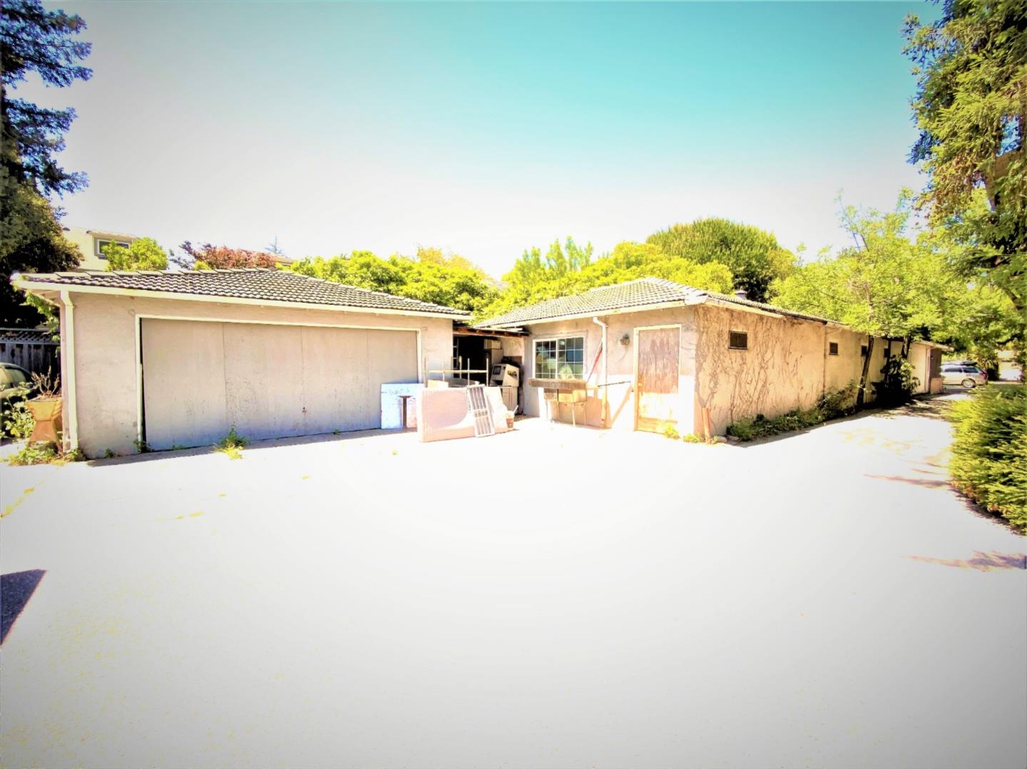 333 Franklin Street Mountain View, CA 94041 - Photo 6 of 8 a front view of a house with a yard and garage