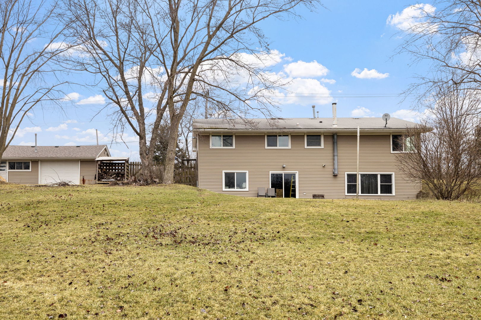 2315 East Steger Road Crete, IL 60417 - Photo 18 of 24 a front view of a house with a garden