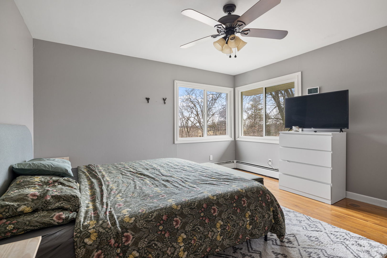 2315 East Steger Road Crete, IL 60417 - Photo 8 of 24 a bedroom with a bed and a flat screen tv