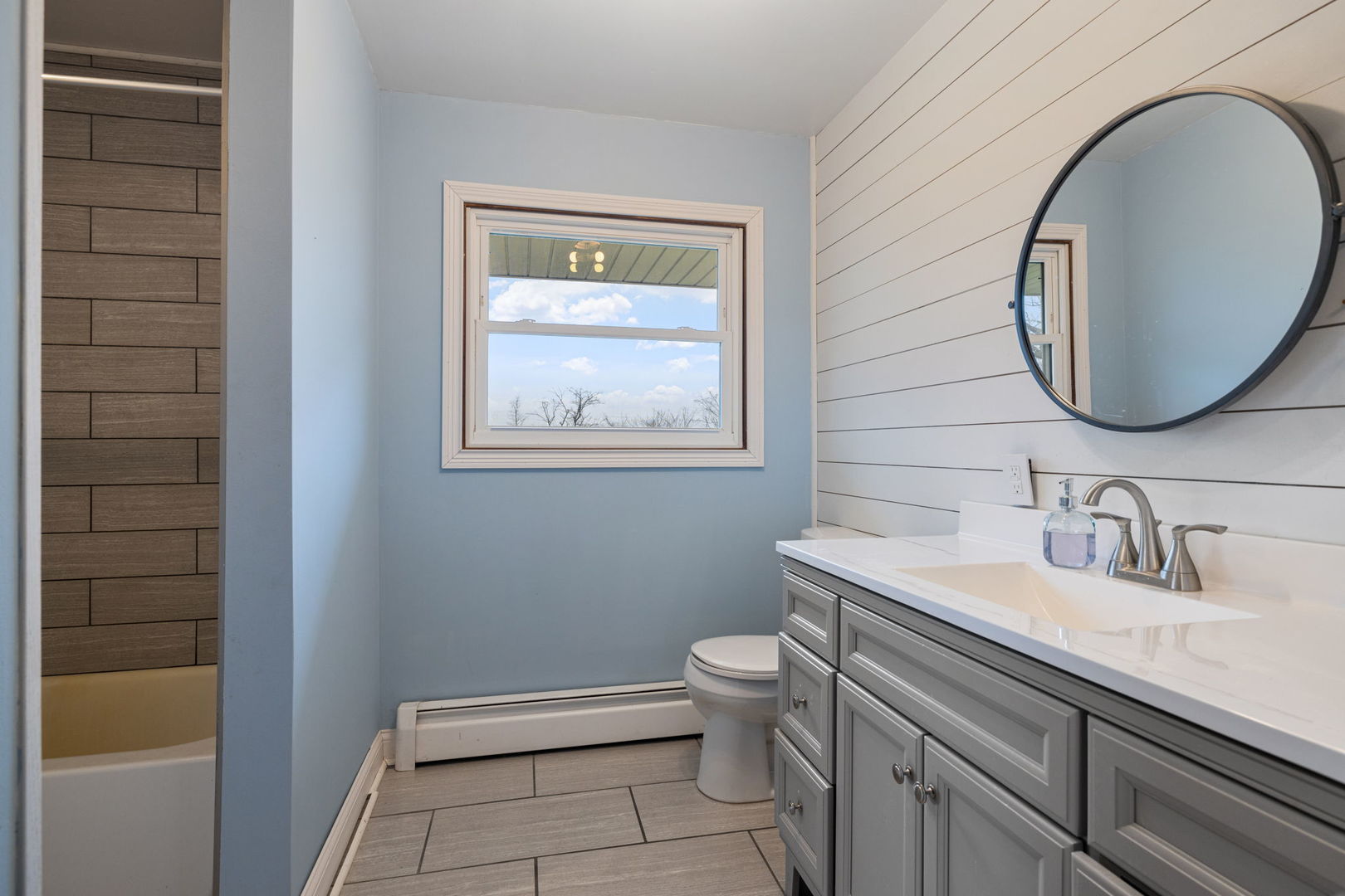 2315 East Steger Road Crete, IL 60417 - Photo 9 of 24 a bathroom with a toilet sink and mirror