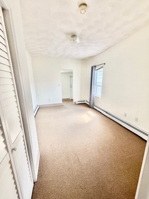 540 Cambridge Street, Unit 3 Cambridge, MA 02141 - Photo 9 of 13 an empty room with windows