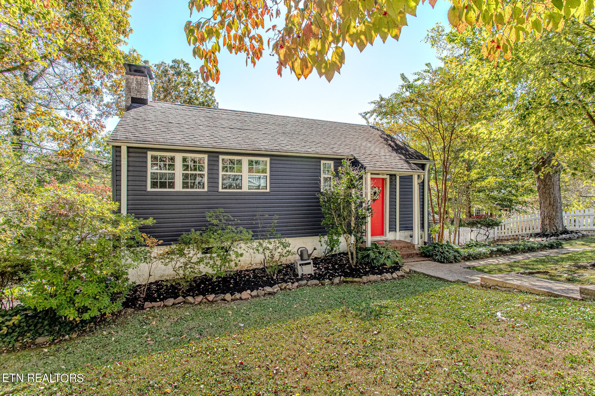 91 Orchard Road Norris, TN 37828 - Photo 11 of 54 a front view of a house with garden