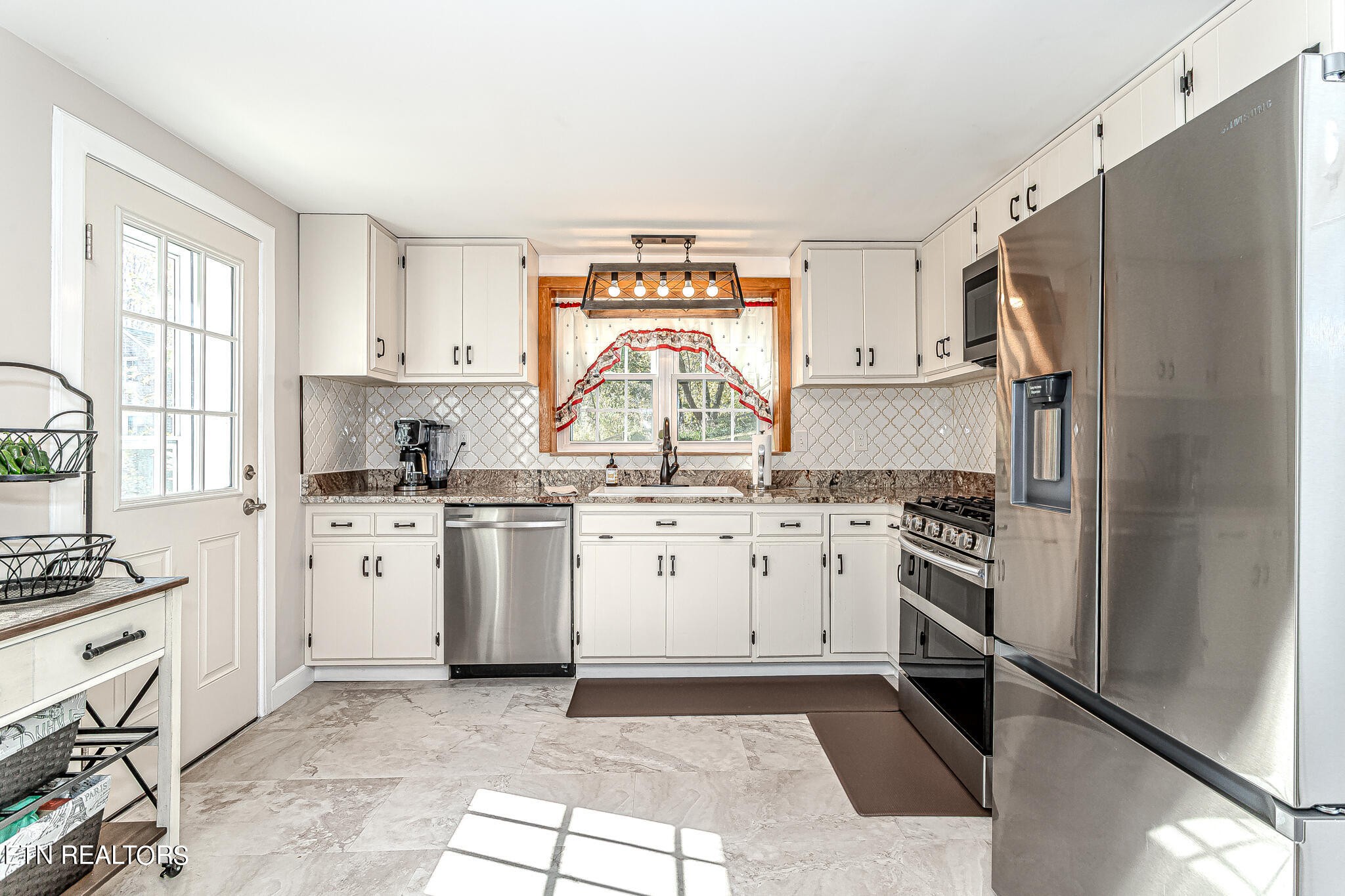 91 Orchard Road Norris, TN 37828 - Photo 14 of 54 a kitchen with appliances cabinets and a sink