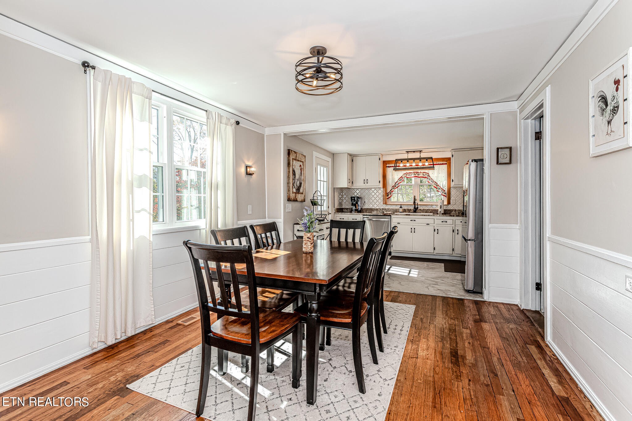 91 Orchard Road Norris, TN 37828 - Photo 16 of 54 a view of a dining room with furniture window and wooden floor