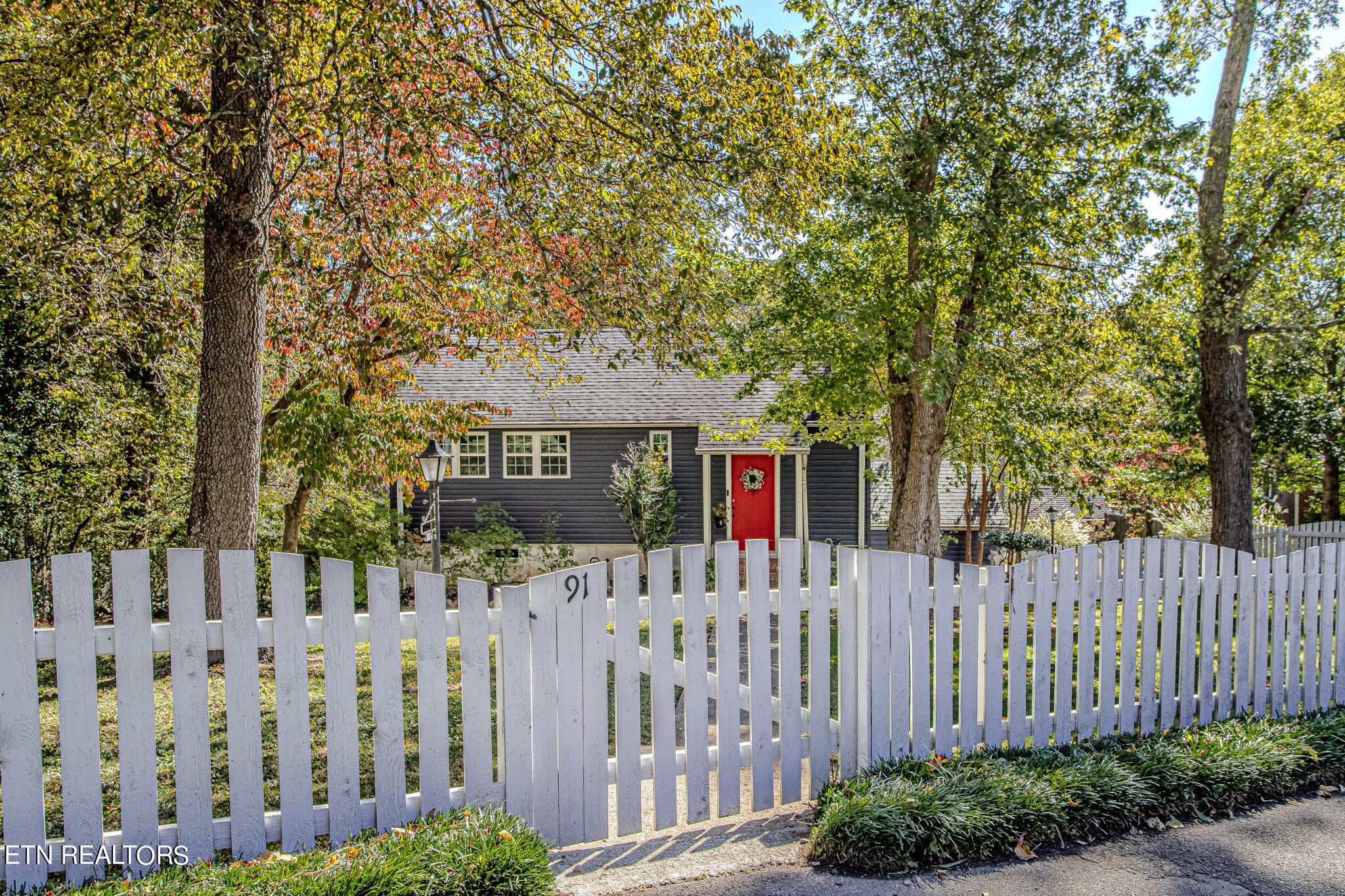 91 Orchard Road Norris, TN 37828 - Photo 2 of 54 a view of a wooden fence