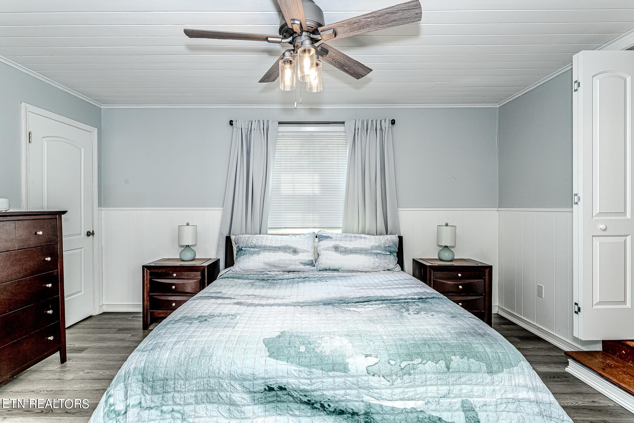 91 Orchard Road Norris, TN 37828 - Photo 27 of 54 a bedroom with a bed and wooden floor