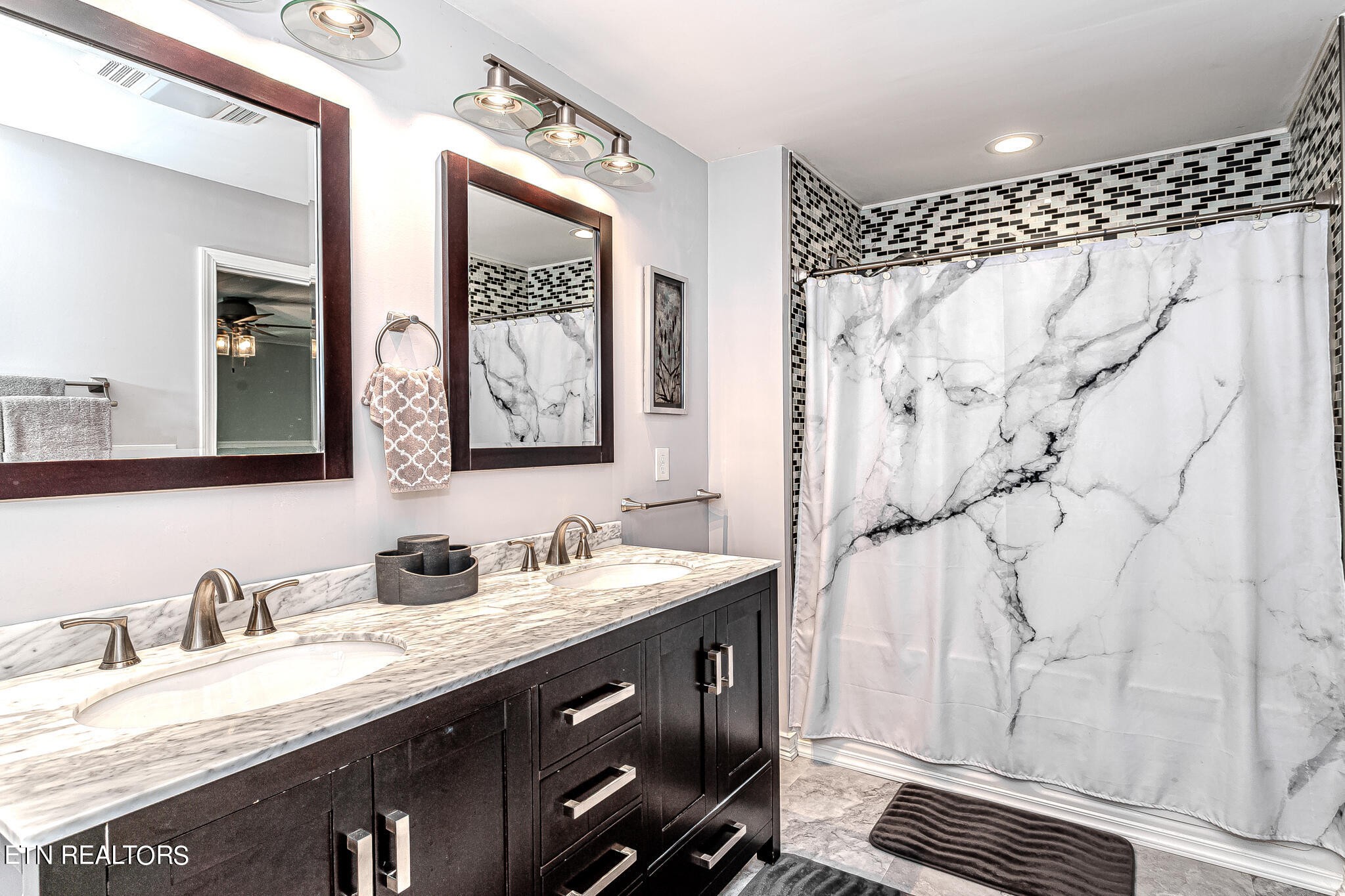 91 Orchard Road Norris, TN 37828 - Photo 28 of 54 a bathroom with a double vanity sink mirror and double