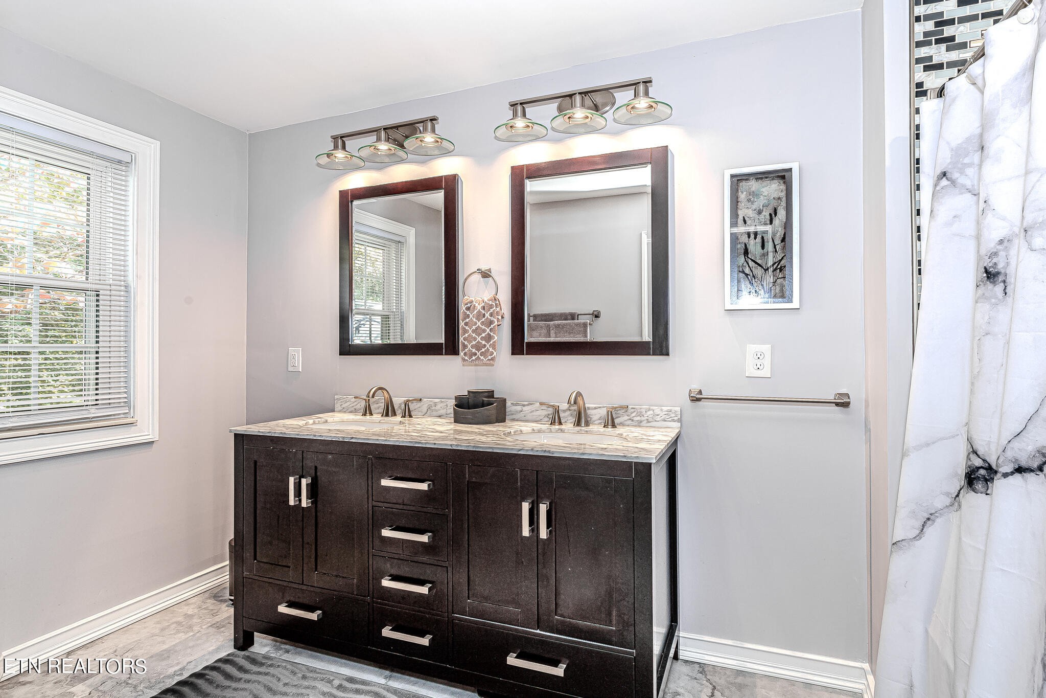 91 Orchard Road Norris, TN 37828 - Photo 29 of 54 a bathroom with a double vanity sink and a mirror
