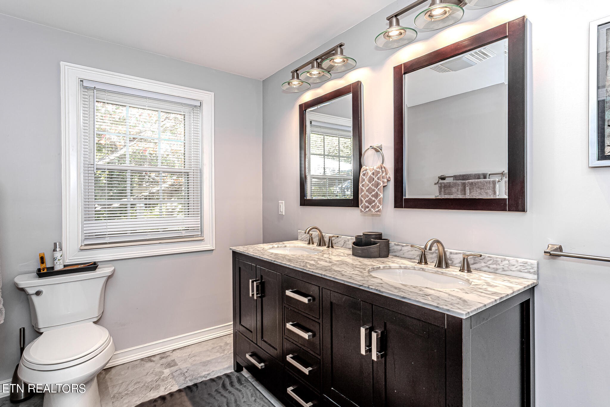 91 Orchard Road Norris, TN 37828 - Photo 30 of 54 a bathroom with 2 sink and a toilet