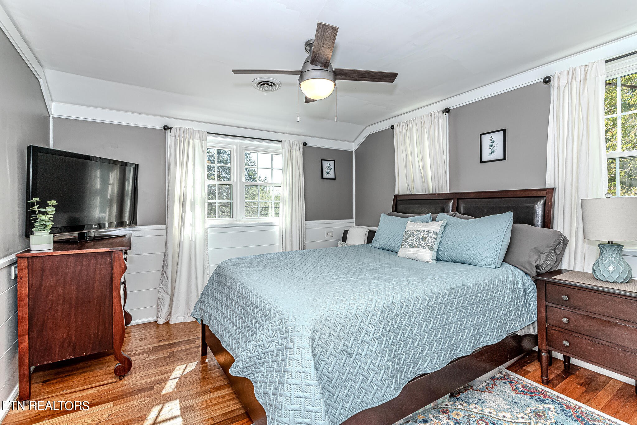91 Orchard Road Norris, TN 37828 - Photo 32 of 54 a bedroom with a bed and a flat screen tv