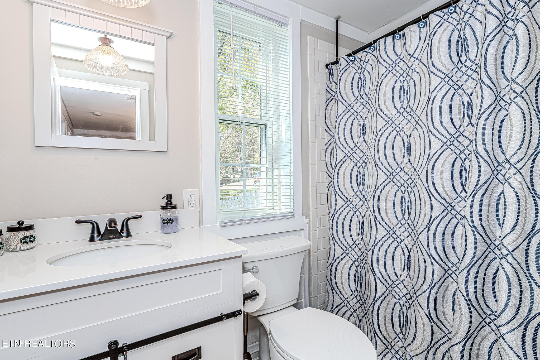 91 Orchard Road Norris, TN 37828 - Photo 35 of 54 a bathroom with a sink and a mirror