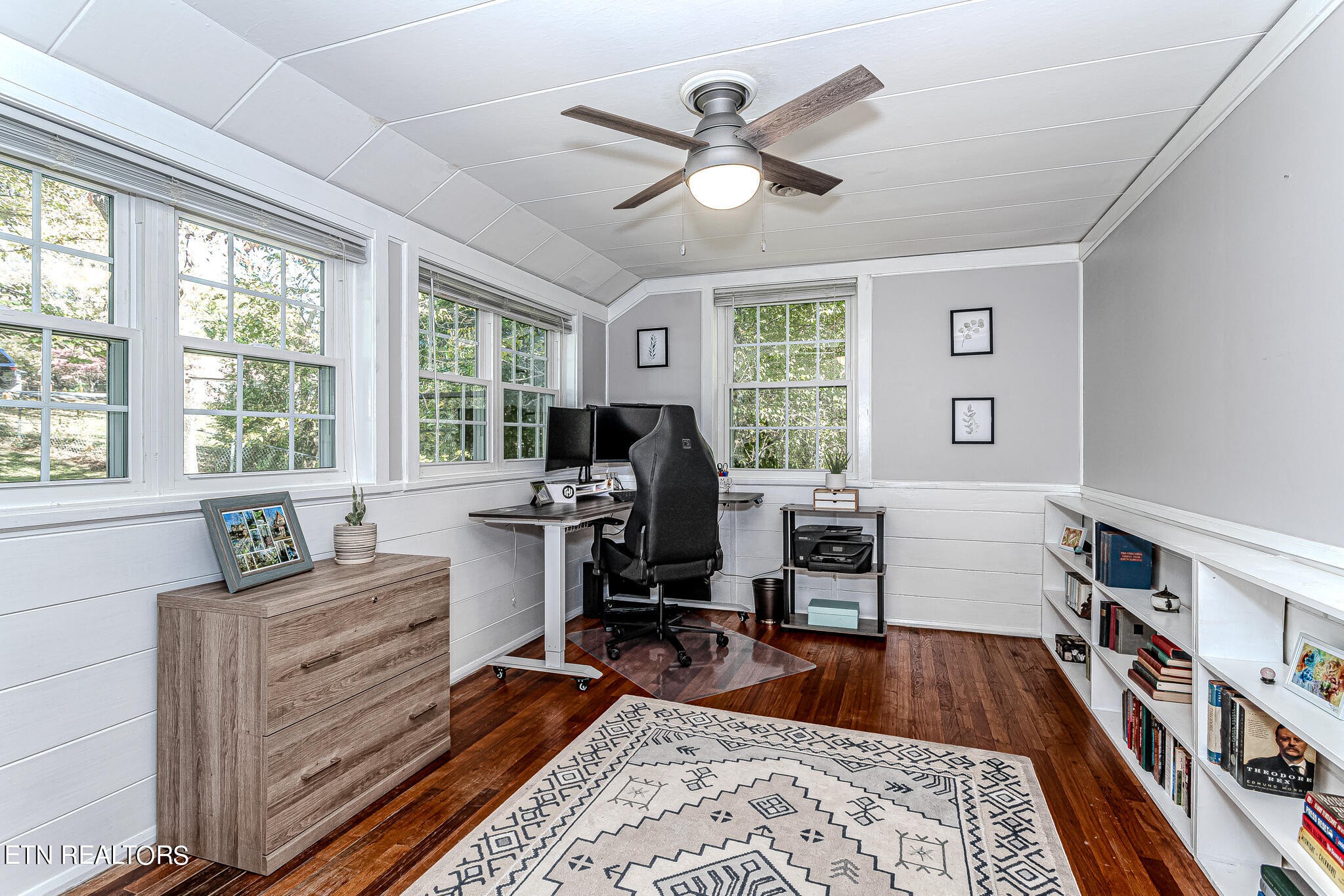 91 Orchard Road Norris, TN 37828 - Photo 36 of 54 a living room with furniture and a wooden floor