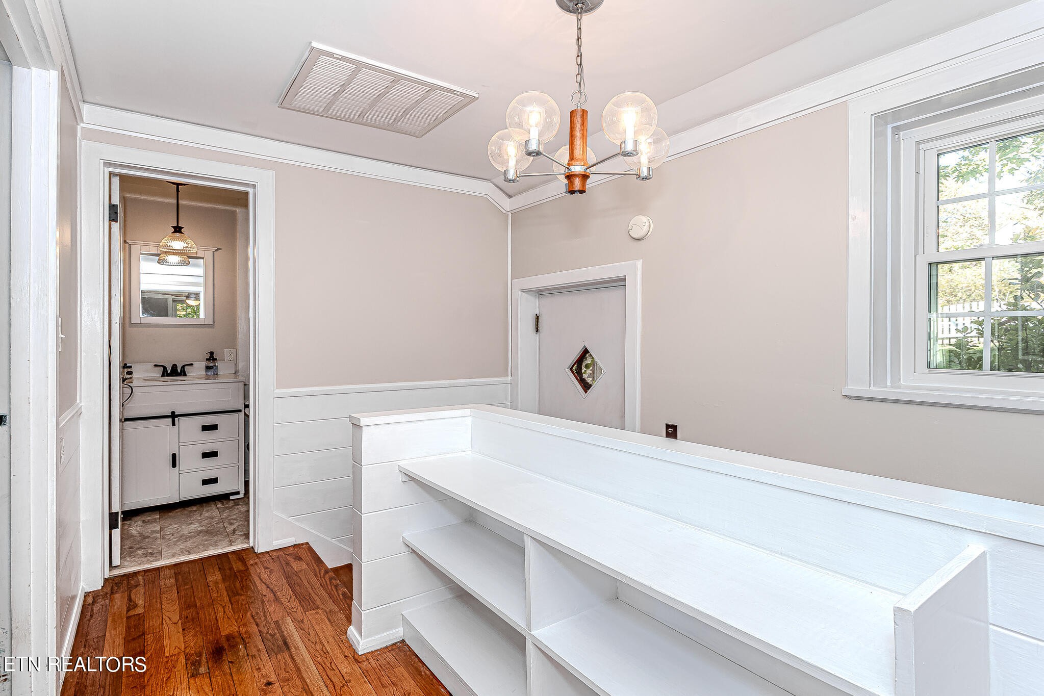 91 Orchard Road Norris, TN 37828 - Photo 39 of 54 a spacious bedroom with a bed and a dresser