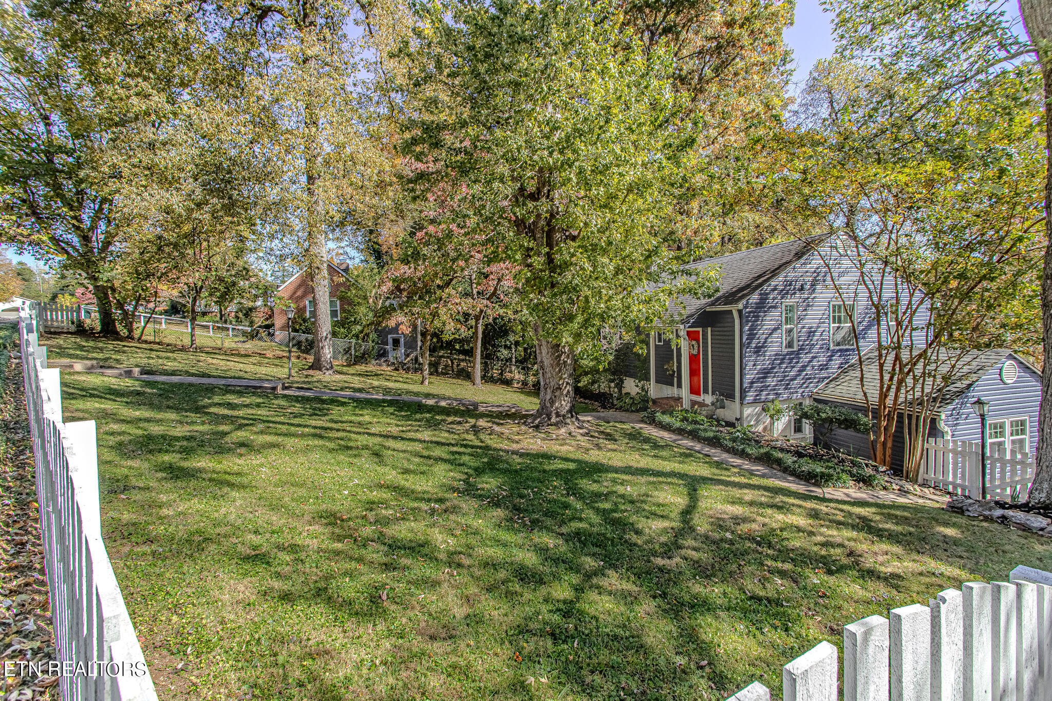 91 Orchard Road Norris, TN 37828 - Photo 43 of 54 a view of a house with a yard