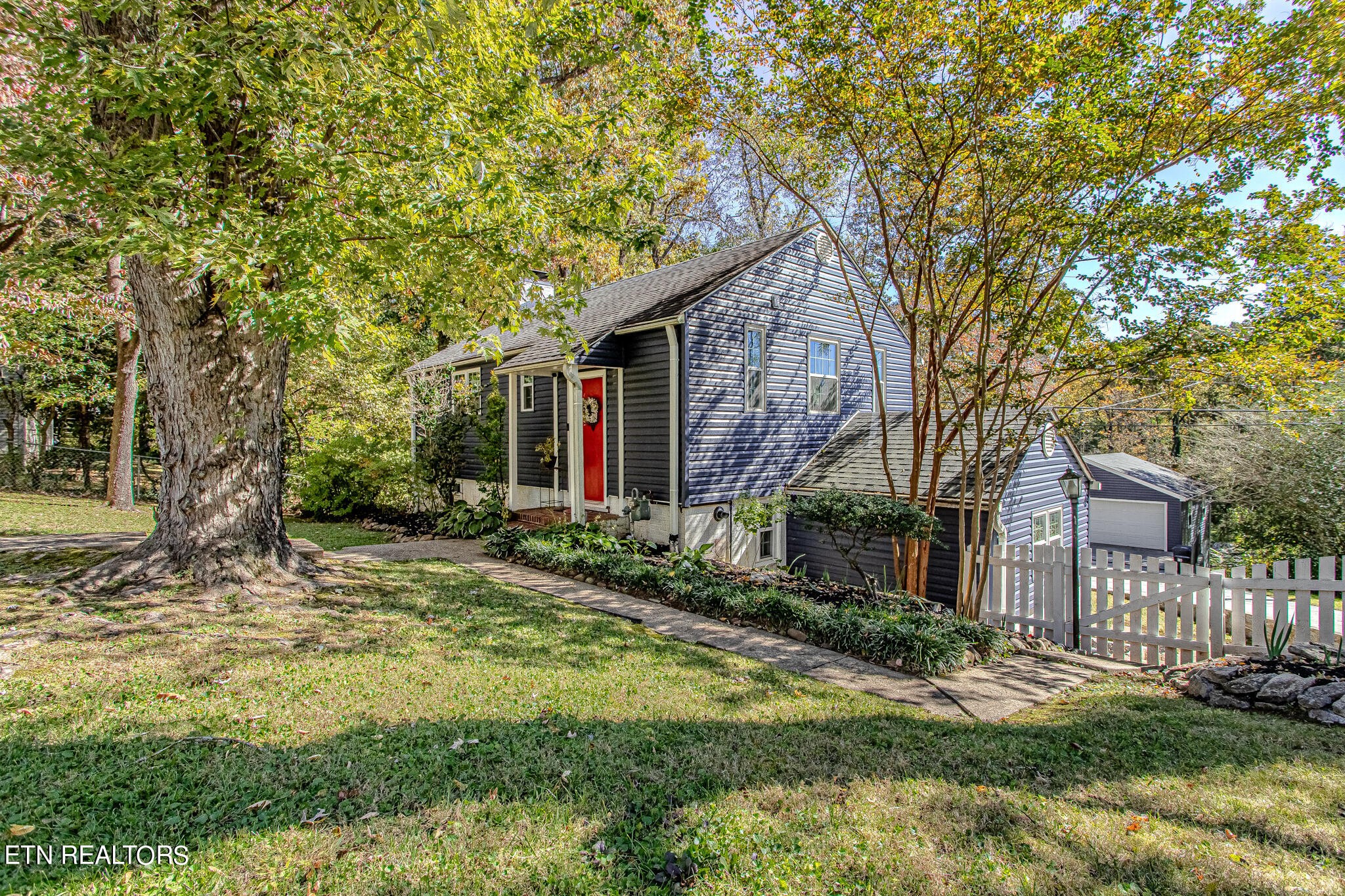91 Orchard Road Norris, TN 37828 - Photo 45 of 54 a view of a house with backyard and tree