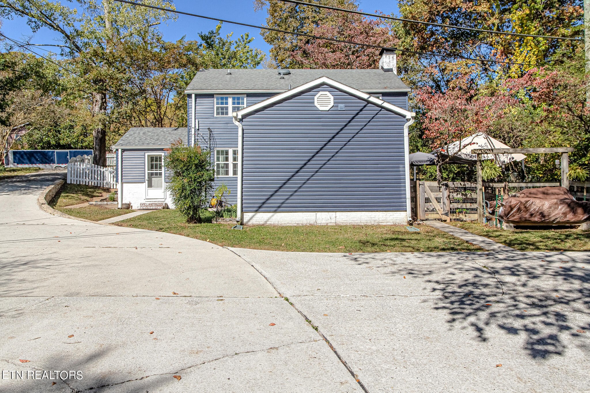 91 Orchard Road Norris, TN 37828 - Photo 46 of 54 a view of a house with a patio