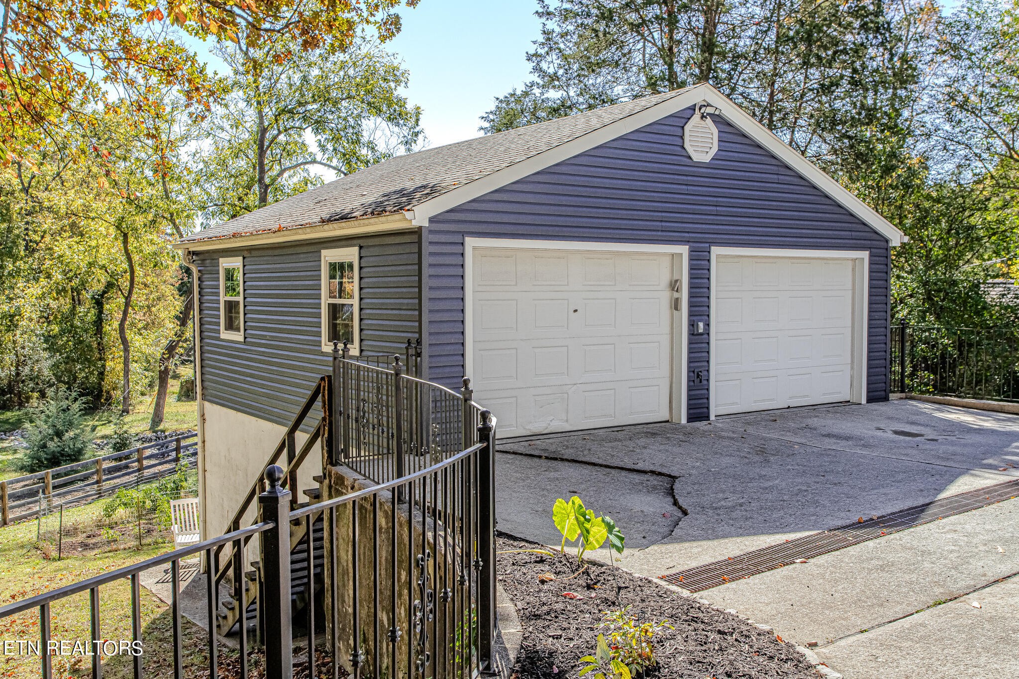 91 Orchard Road Norris, TN 37828 - Photo 51 of 54 a front view of house with garage and yard