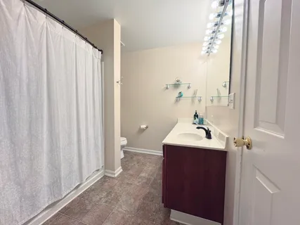 a bathroom with a sink and mirror