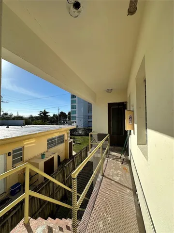 a view of a balcony with chairs
