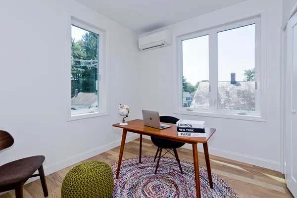 a workspace with furniture and a window