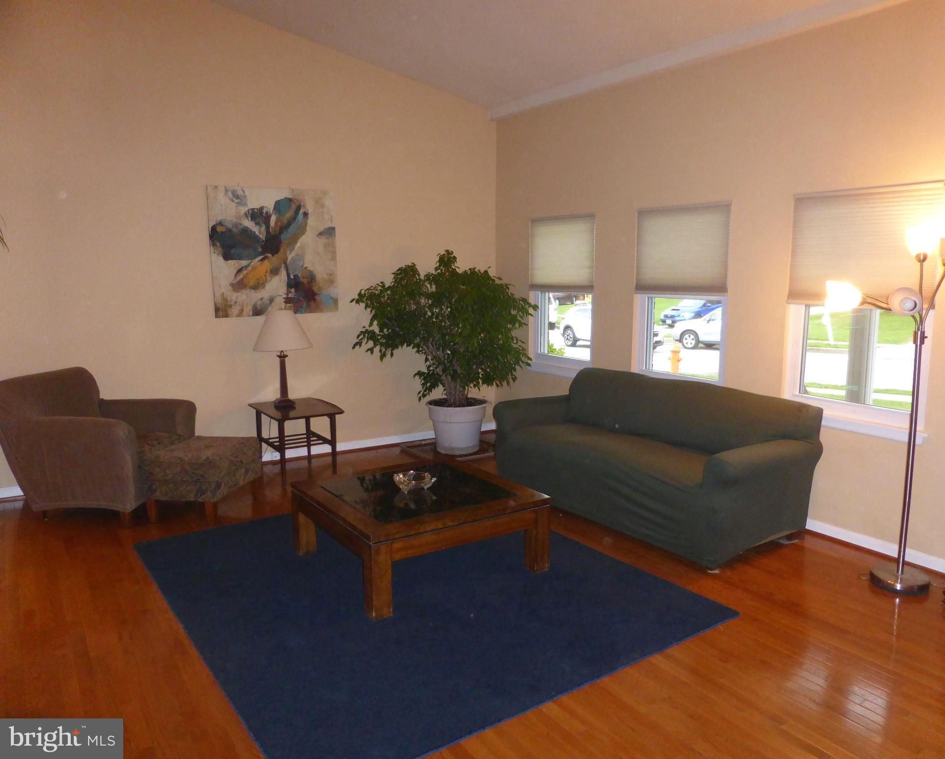 9107 Bowline Road Baltimore, MD 21236 - Photo 2 of 19 a living room with furniture and a wooden floor