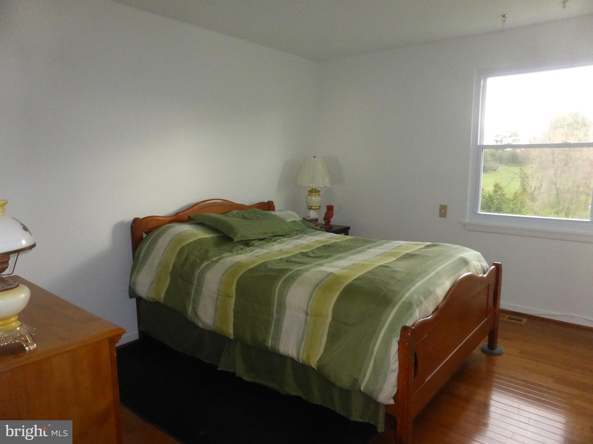 9107 Bowline Road Baltimore, MD 21236 - Photo 12 of 19 a bedroom with a bed and window