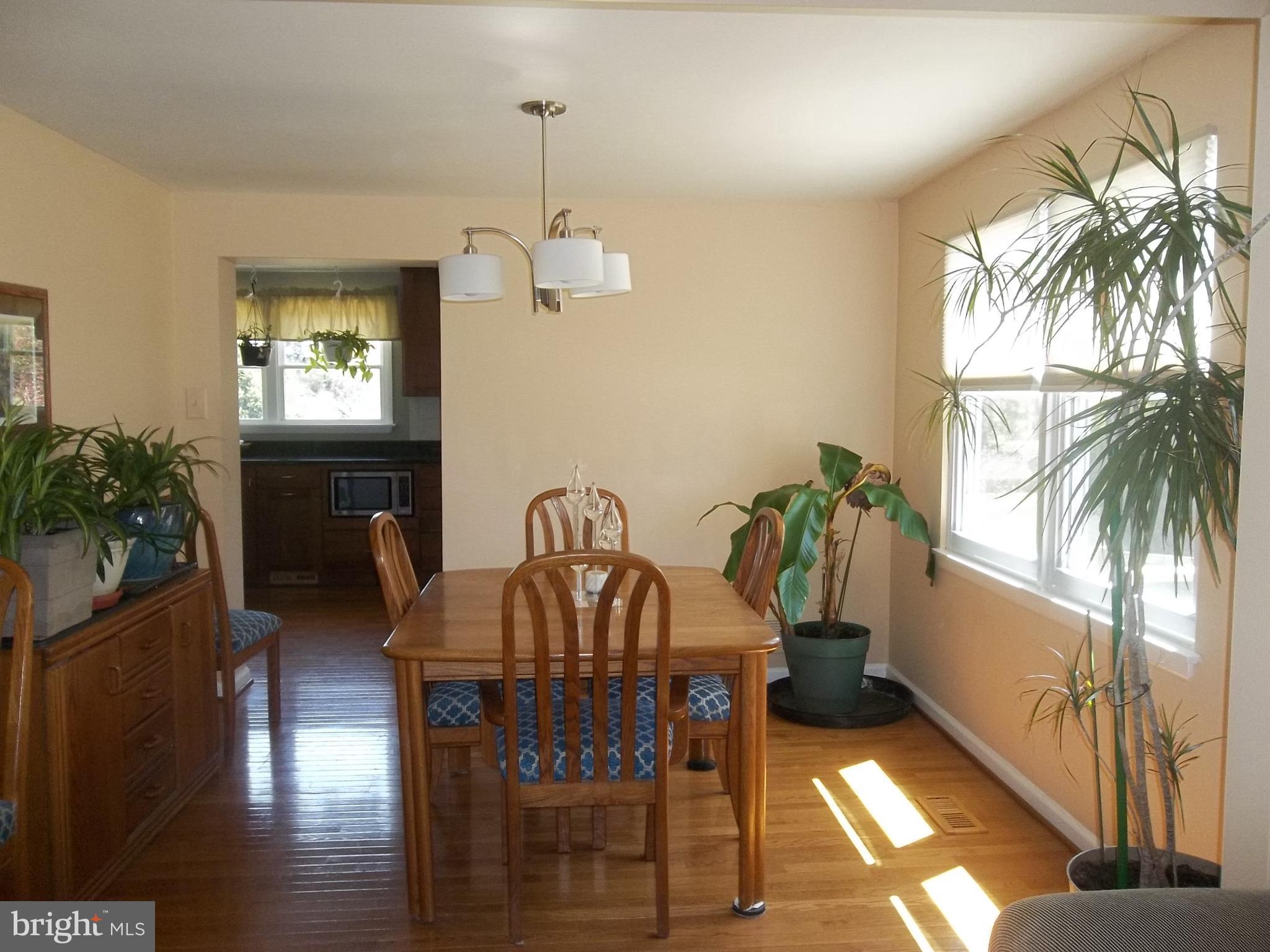 9107 Bowline Road Baltimore, MD 21236 - Photo 4 of 19 a view of a dining room with furniture window and wooden floor