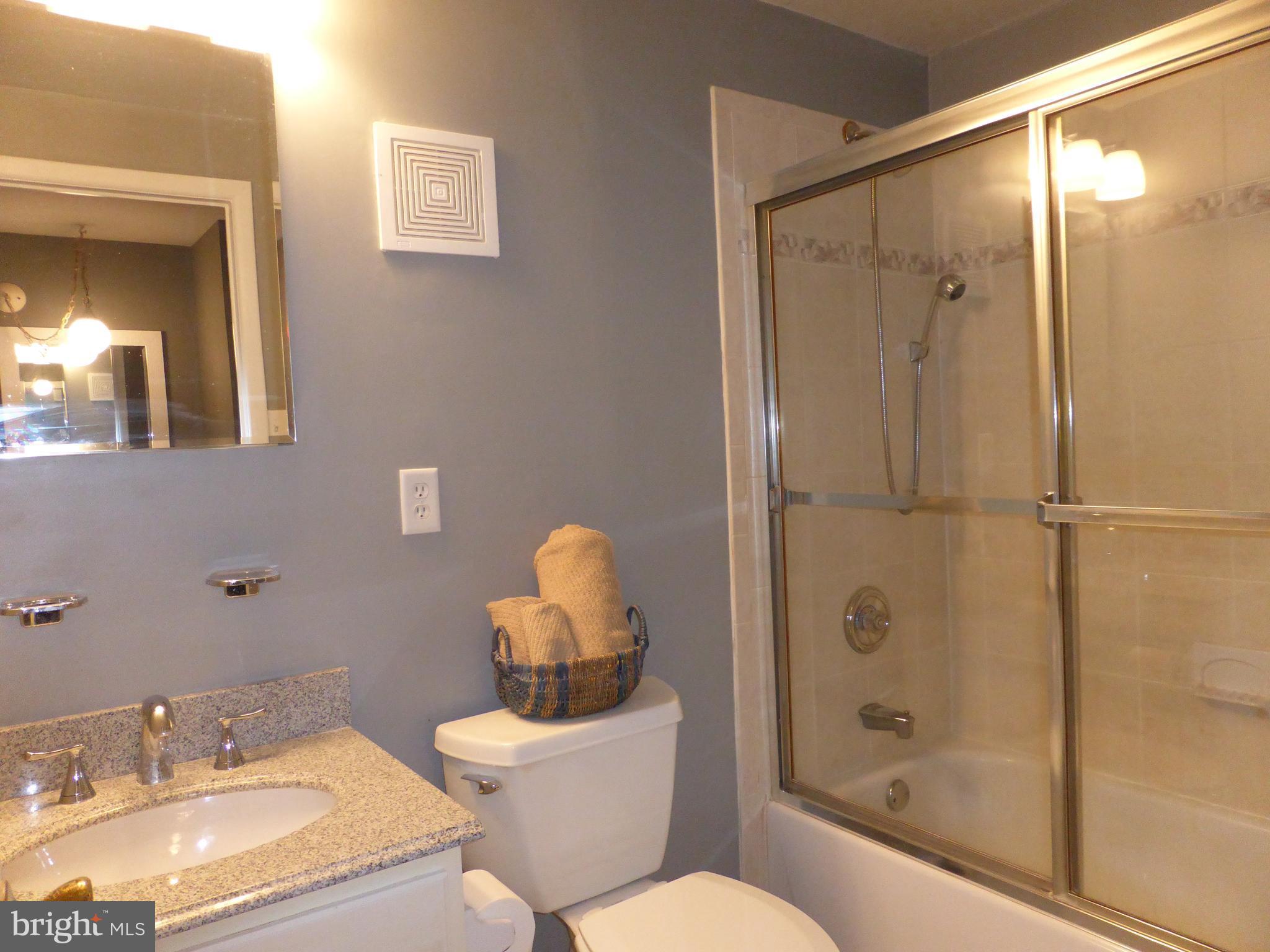 9107 Bowline Road Baltimore, MD 21236 - Photo 10 of 19 a bathroom with a sink toilet and shower