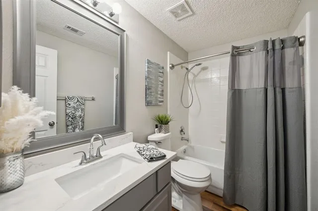 a kitchen with a center island wooden floor and a appliances